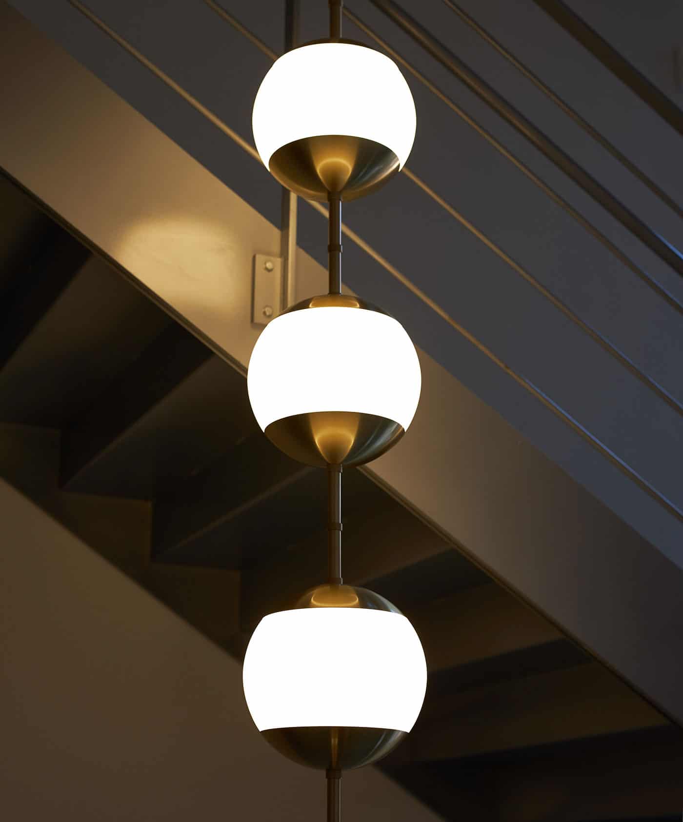 RUBN-staircase-lamp-monroes-pearl-three-opal-glass-globes-row-brass-steel-1